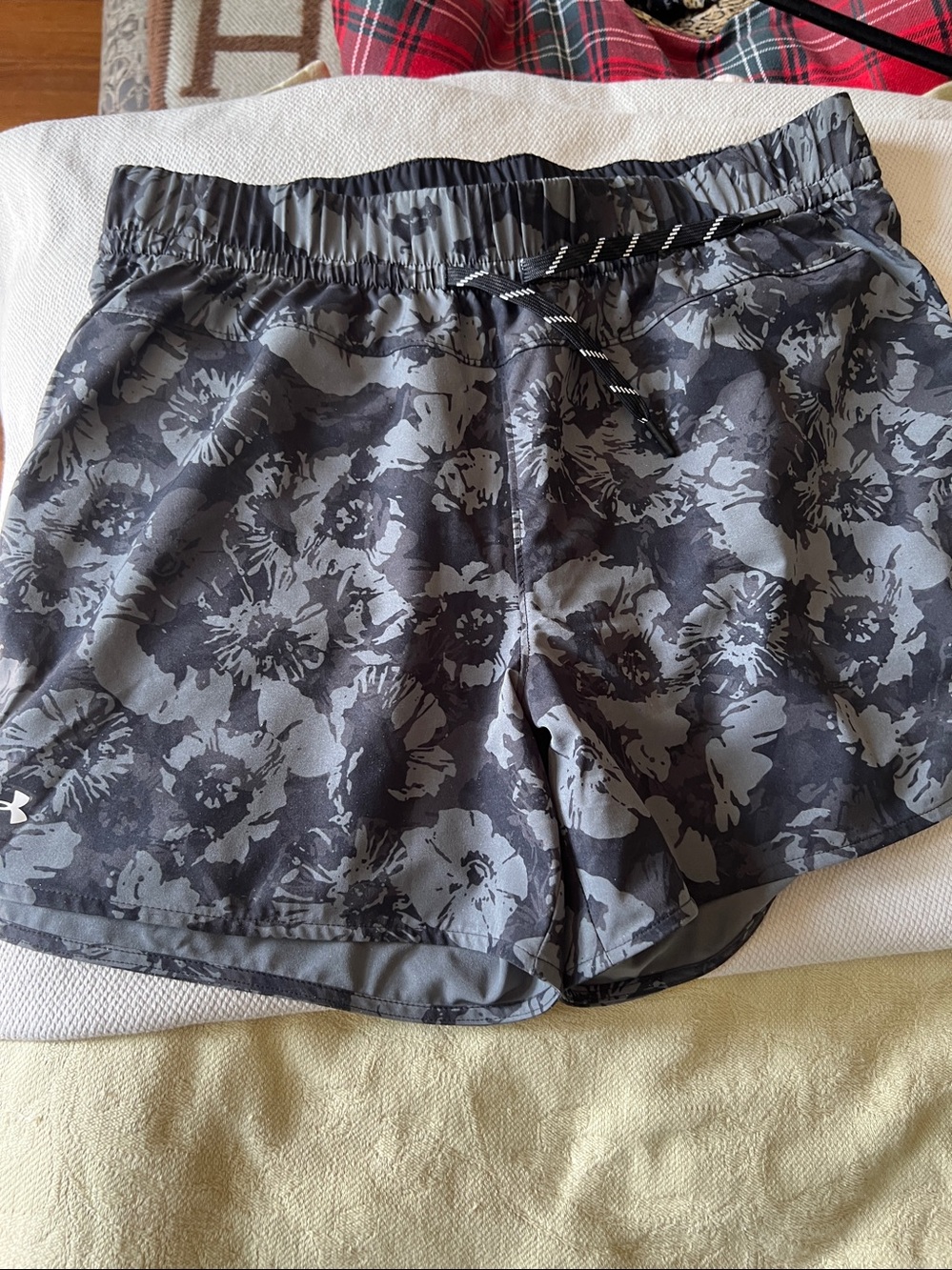 Under Armor flowered shorts. Never worn.